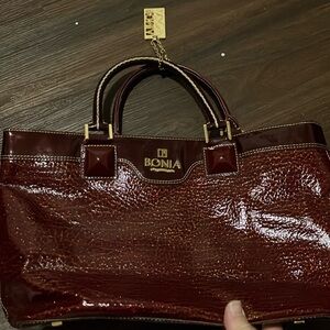 Bonia maroon and gold leather purse.